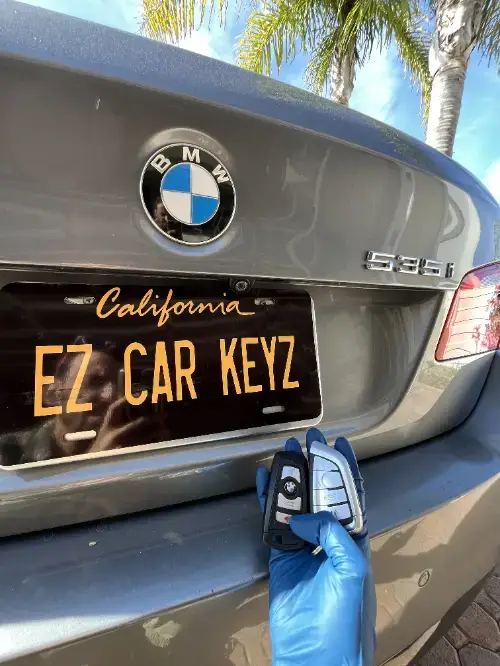 Bmw 535 Key Fob On Sports Car Armrest Surface - EZ Car Keyz Torrey Pines, Del Mar