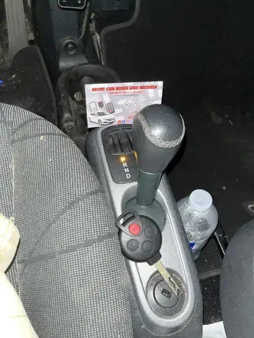 Bmw Just Programmed Key Fob On Compact Car Armrest - EZ Car Keyz Via Real Corridor, Carpinteria