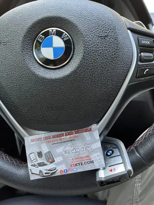 Bmw Remote Head Key On Truck Armrest - EZ Car Keyz Otay Ranch, Chula Vista