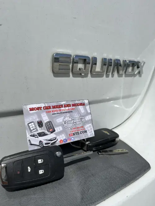 Chevrolet Equinox Smart Key Fob On Sports Car Center Console Finished - EZ Car Keyz Windsor North/River Ridge, Oxnard
