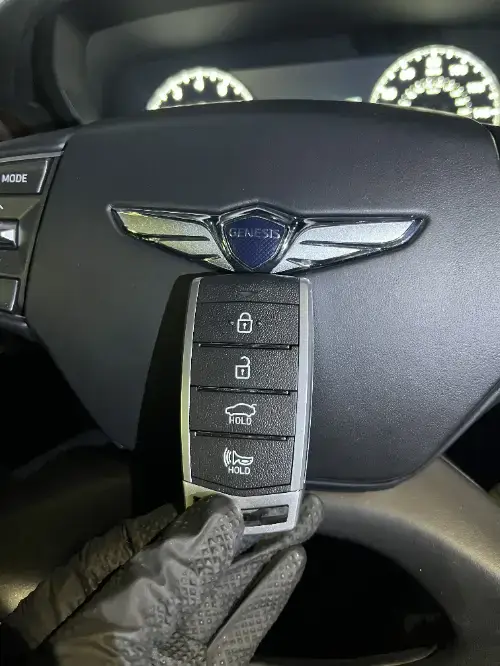 Genesis Smart Key Fob On Pickup Truck Dashboard Center - EZ Car Keyz Alpine Village, Alpine