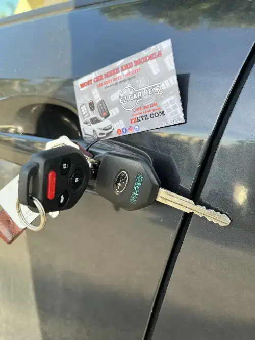 Honda Remote Head Key On Compact Car Armrest - EZ Car Keyz College, Ventura