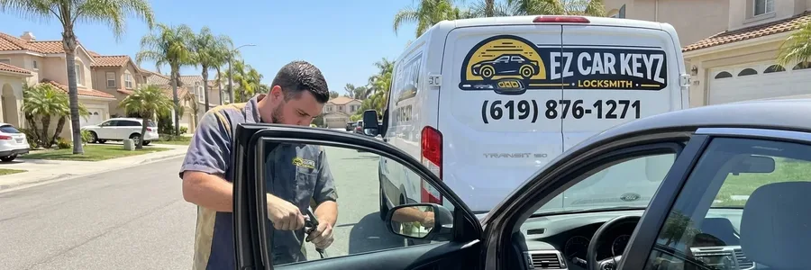 Automotive locksmith programming car key in driver seat in Rancho Bernardo