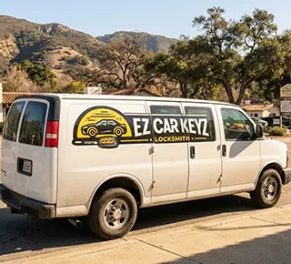 EZ Car Keyz mobile van at an Oak Park school pickup with Tesla smart-key service