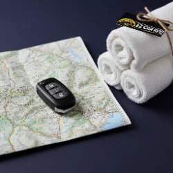 Car key with a trail map and Ojai Valley Inn spa towels - retreat, spa, and hiker lockouts