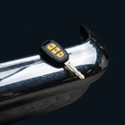 Classic car key on a chrome bumper - Oxnard lowrider car club scene