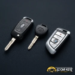 Ford, Toyota, and BMW car keys laid out in Oxnard - European imports from Port Hueneme