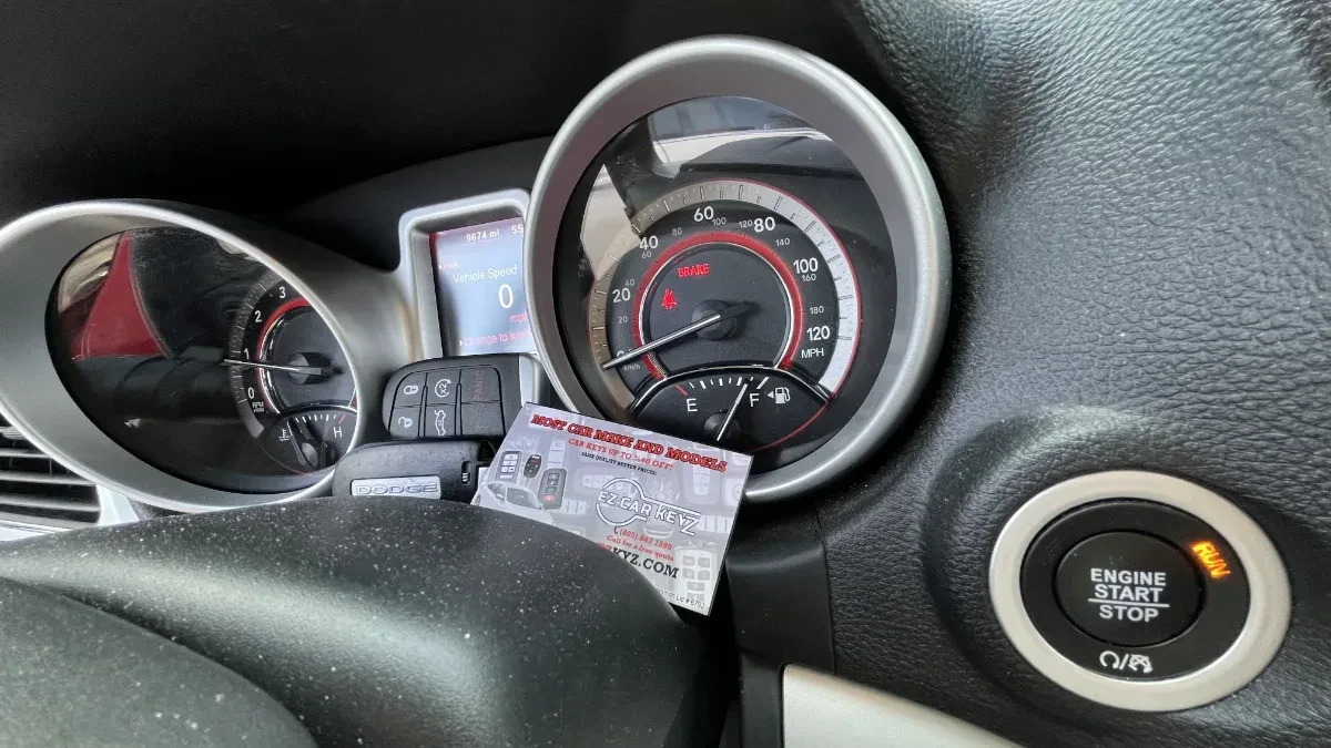Insured mobile locksmith working on 2010 Dodge Challenger in Carlsbad CA