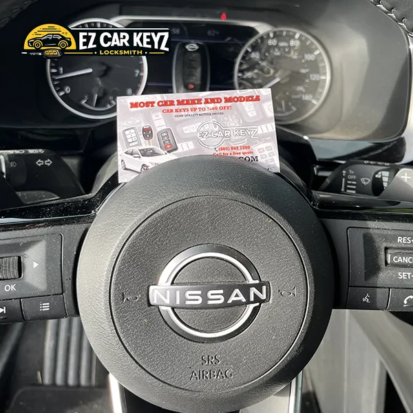Smart key next to push-to-start button by EZ Car Keyz in San Diego