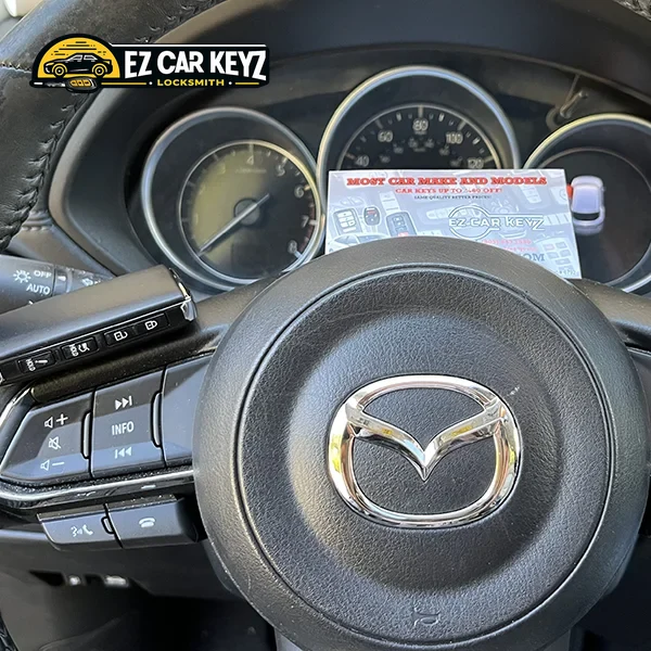 Smart key next to push-to-start button by EZ Car Keyz in Ventura County