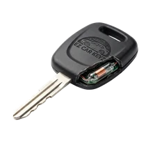 Cutting and pairing a fixed-code transponder key for a 2003 Toyota 4Runner at a driveway in Santa Barbara, California.