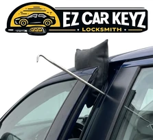 Emergency lockout response at a parking garage at midnight in Oak Park, California, with keys visible inside a 2018 Honda Civic. Professional air wedges and long-reach tools clear the door without leaving a mark on the paint or the weather seal.