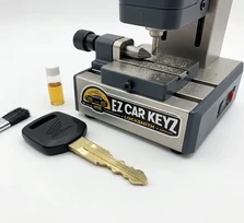 Standard motorcycle key cut for a Kawasaki Ninja at a home garage in Santa Paula, California. The narrow single-sided Kawasaki keyway needs the correct blank and a machine that handles the profile, neither of which a generic shop stocks.
